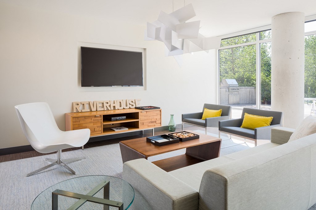 a living room with a couch and a table and a television