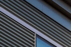 the facade of a building with a blue sky in the background
