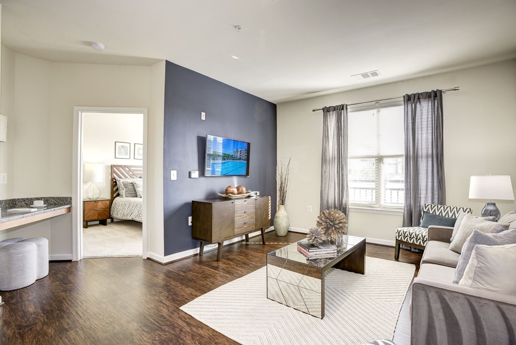 a living room with a blue accent wall and a couch