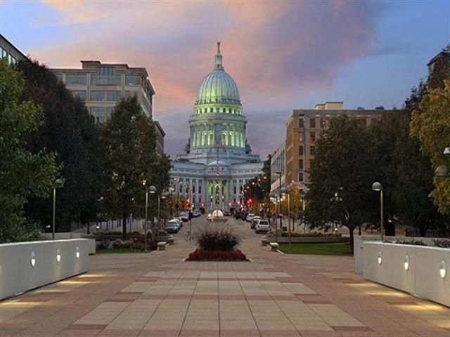 a view of the capitol building at sunset