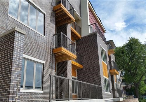 a brick building with wooden balconies on it