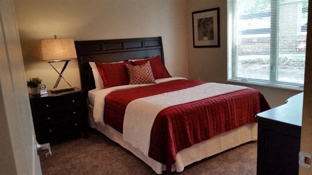 a bedroom with a bed and two night stands