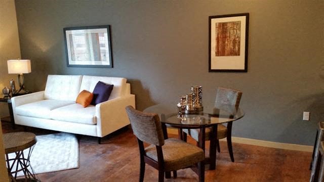 a living room with a table and a couch