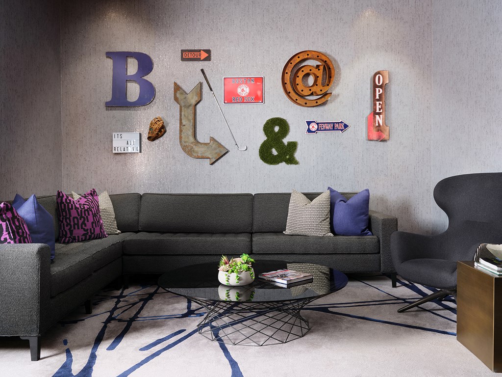 a living room with a gray couch and a coffee table