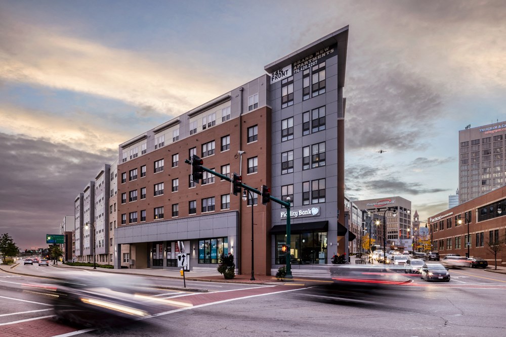 a large building on a city street with traffic