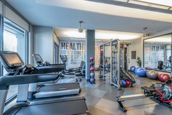 State-of-the-art fitness center with strength-training equipment, cardio machines, TRX, and SYNRGY360