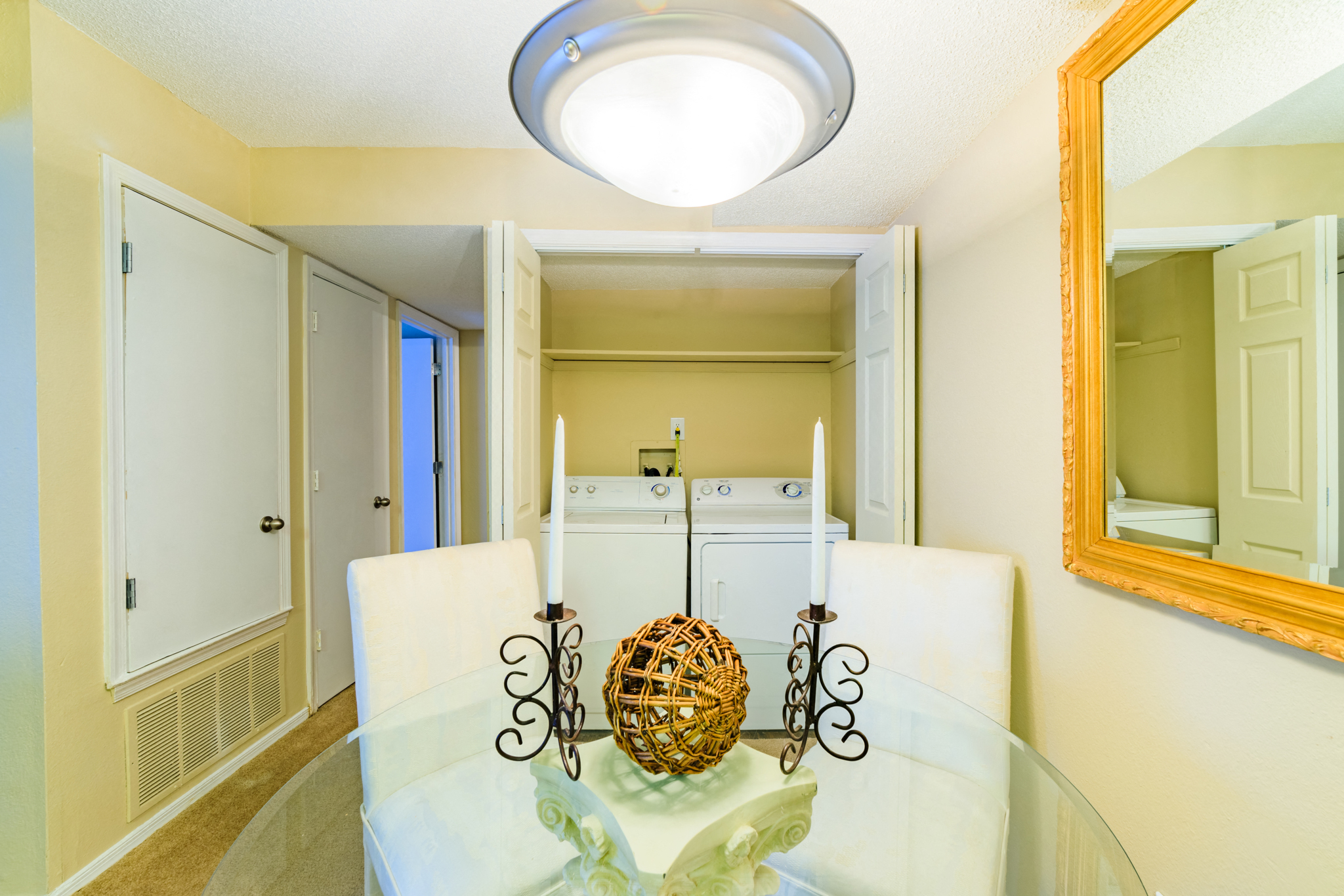 Forest Lake at Oyster Point in Newport News VA Dining Area with a Table and four white chairs and view of washer and dryer