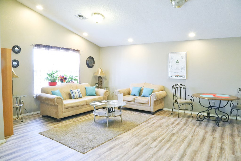 a living room with couches and a table