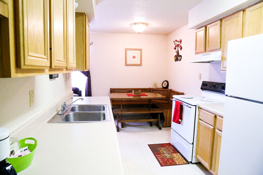 a kitchen with a table and a sink