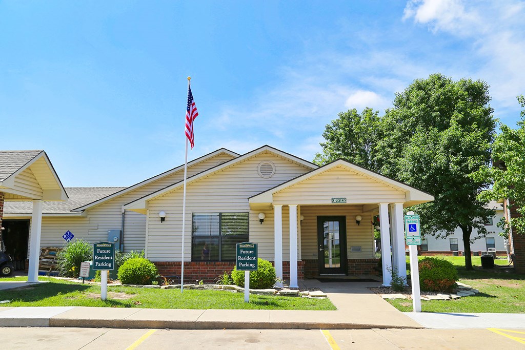 a white building with an flag in front of it