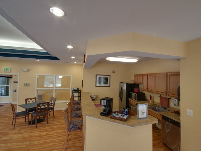 a kitchen and dining area with a table and chairs