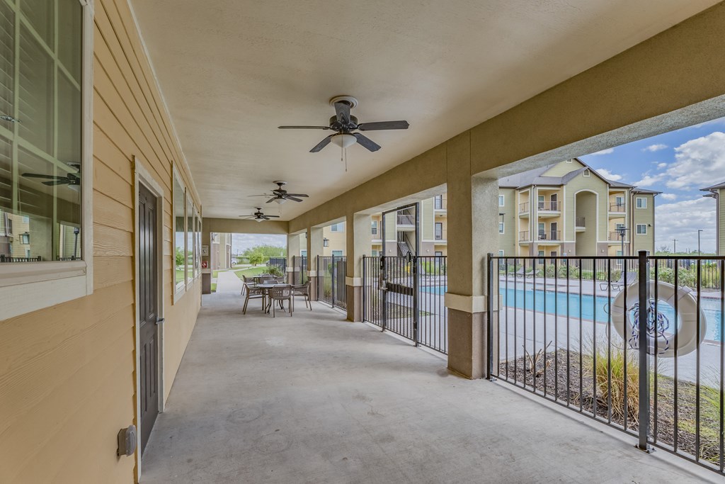 the preserve at ballantyne commons balcony outlook with pool and chairs and tables