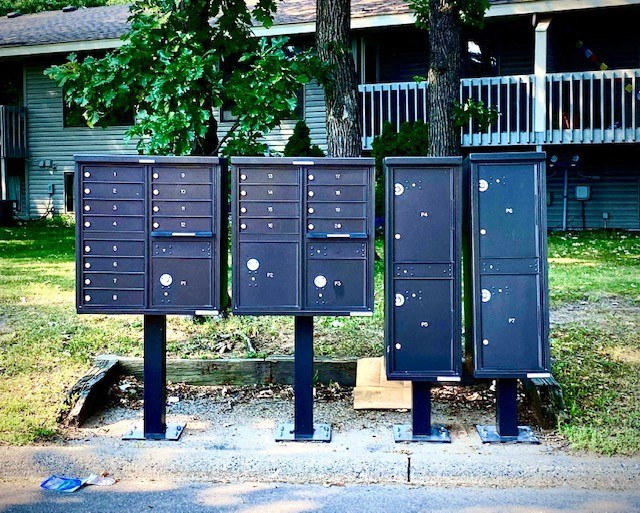 a row of mailboxes on the side of a street