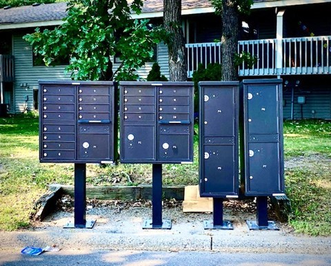 a row of mailboxes on the side of a street