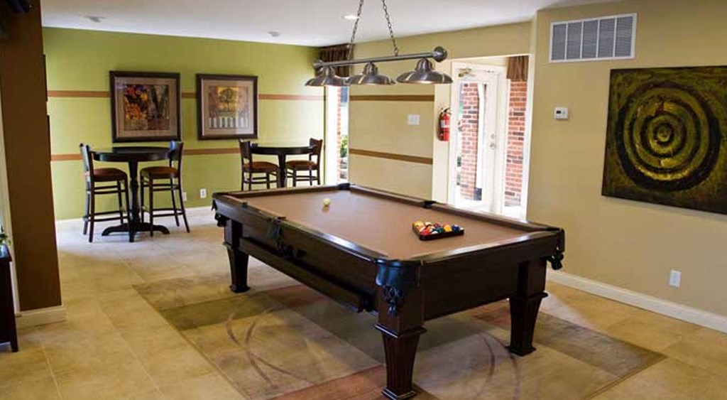 a living room with a pool table