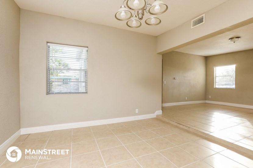 the living room and dining room are spacious and empty