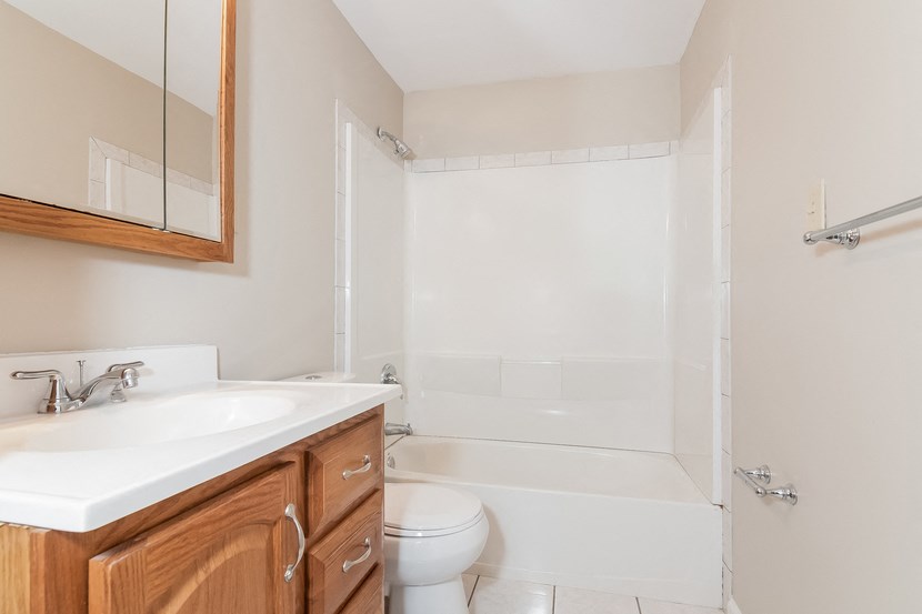 a bathroom with a sink toilet and a shower