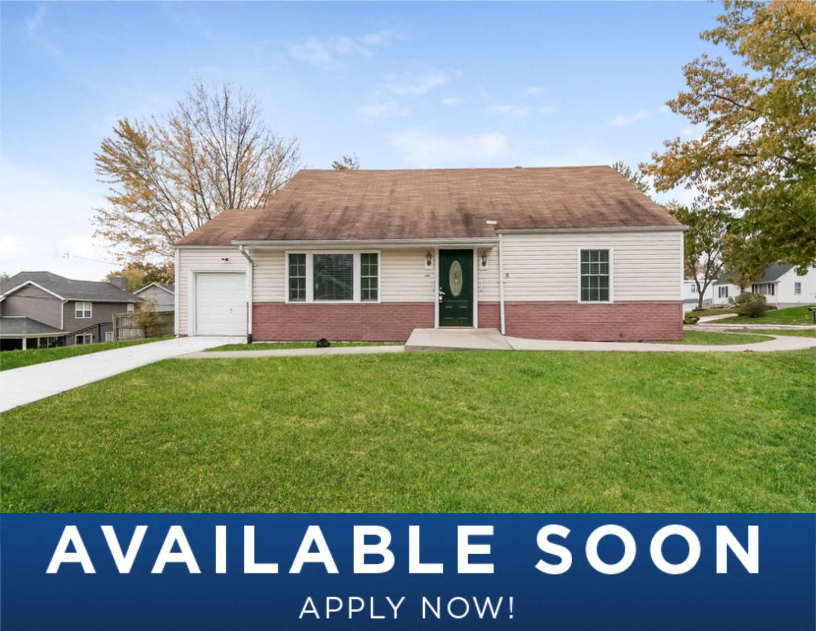 a small white house on a lawn with a green yard