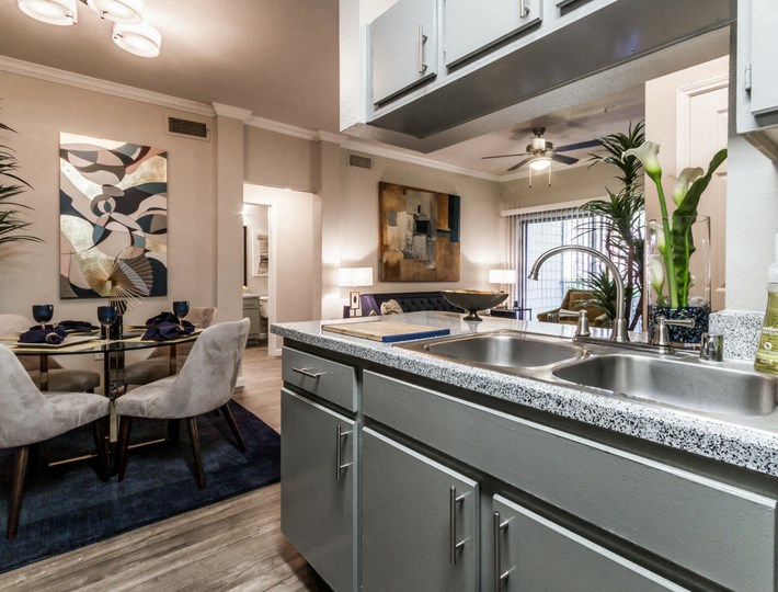 kitchen and dining area at the district flats apartments in lenexa