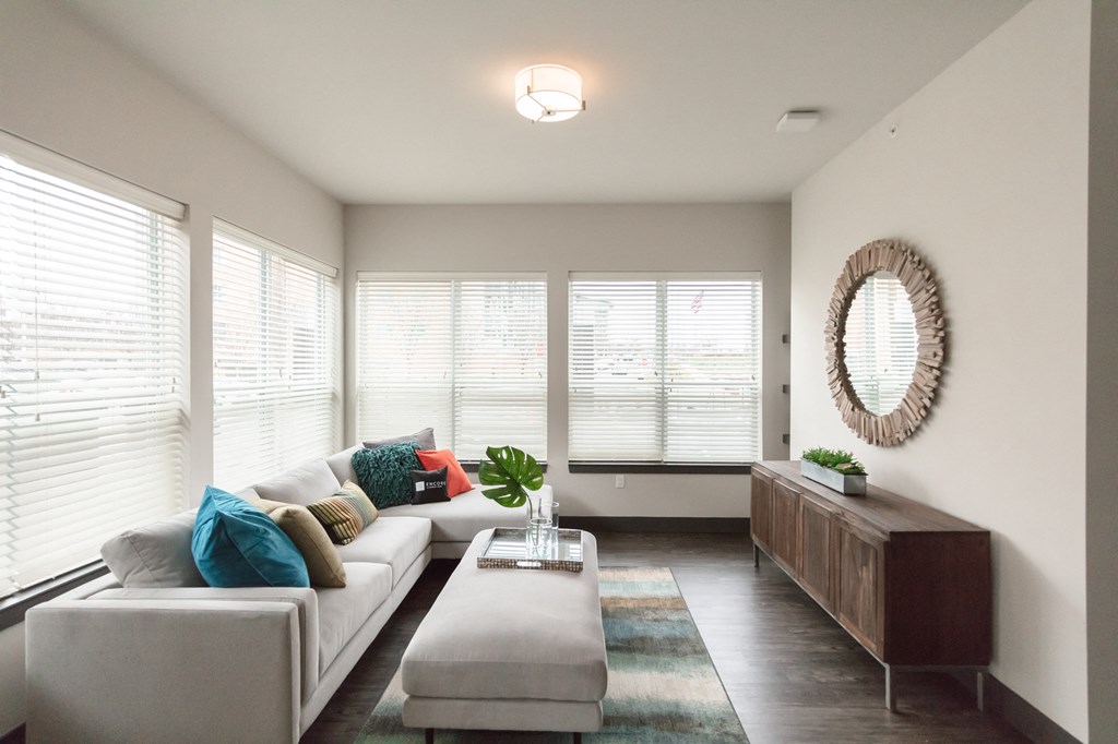 a living room with a white couch and a coffee table