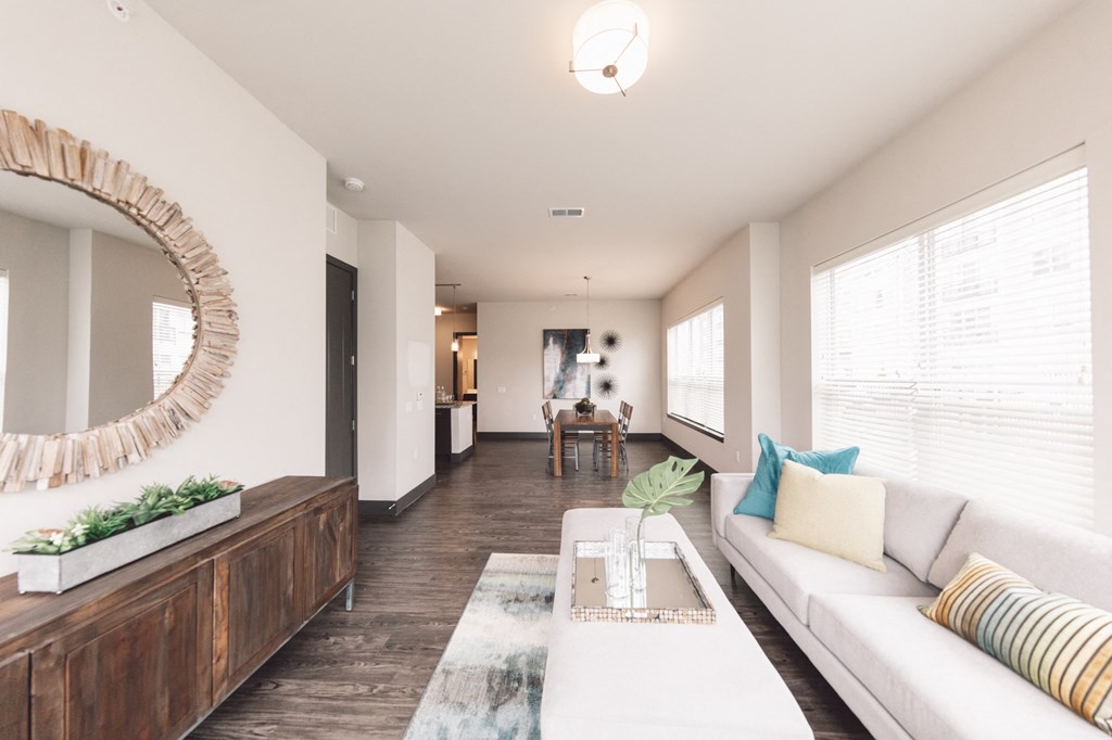 a living room with a white couch and a coffee table