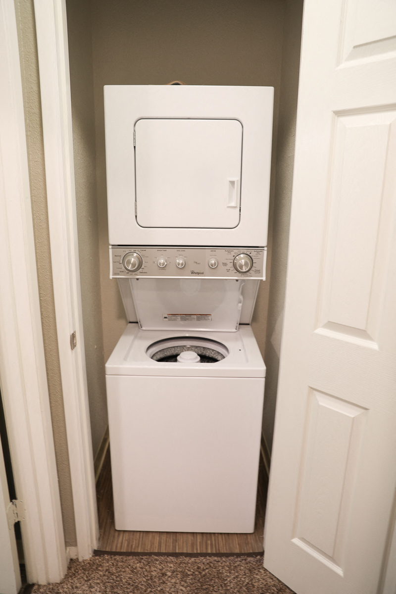 the laundry room has a washer and dryer in it