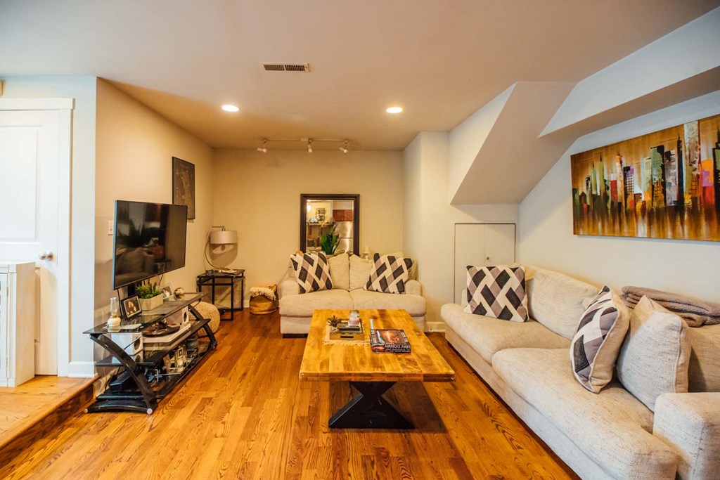 a living room with couches and a coffee table