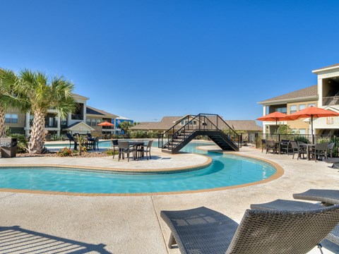 Swimming Pool with Lounge Chairs at La Contessa Luxury Apartments, Laredo,Texas