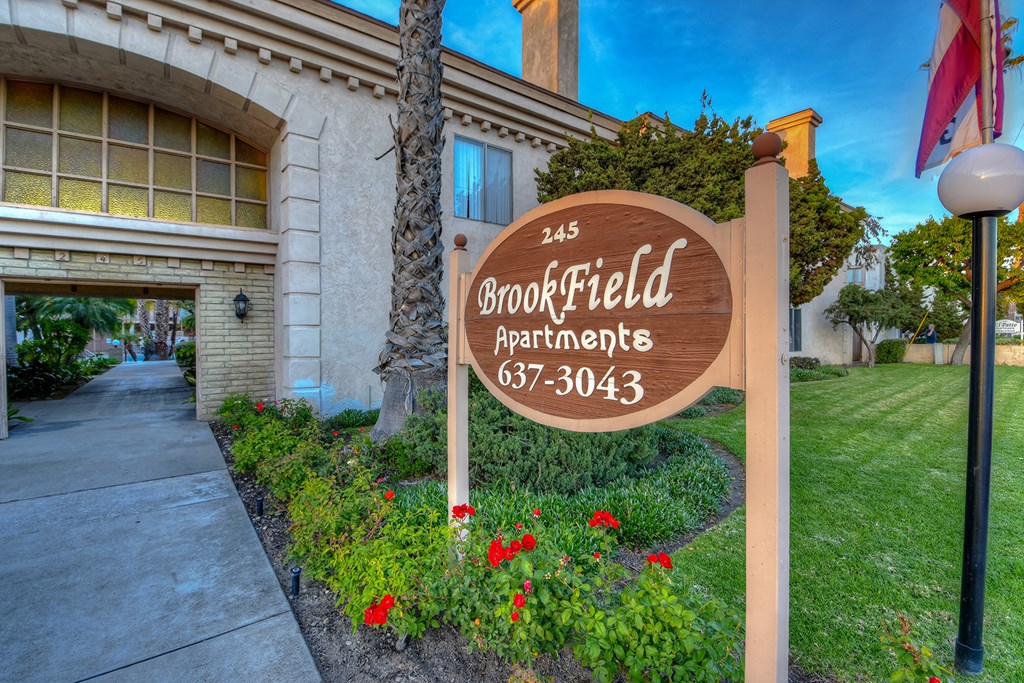 a sign that reads bookfield apartments in front of a building