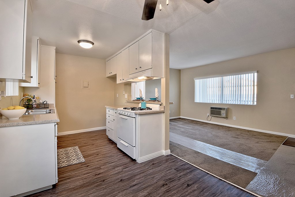 the kitchen and living room of a house with an open floor plan