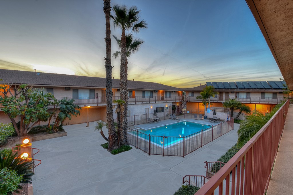 a resort style pool is shown at dusk
