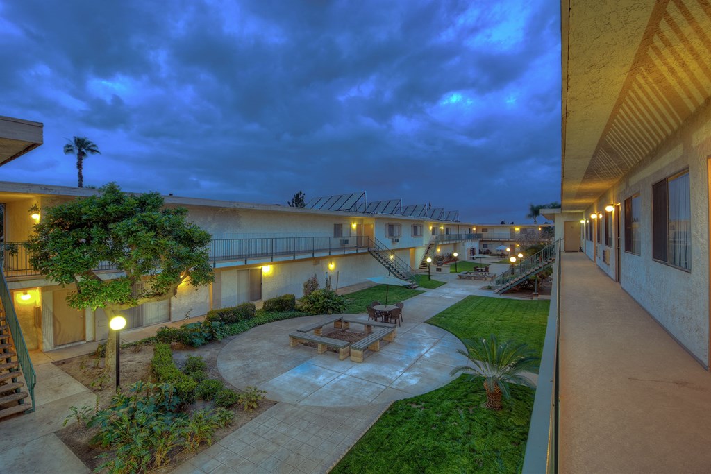 a building with a courtyard at night