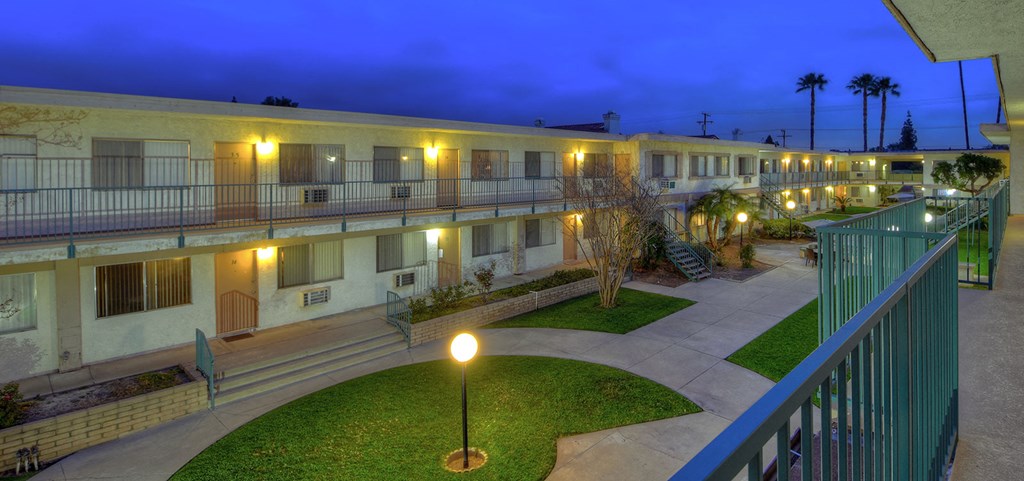 a building with a courtyard and a lot of lights