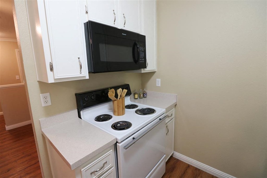a kitchen with a stove and a microwave