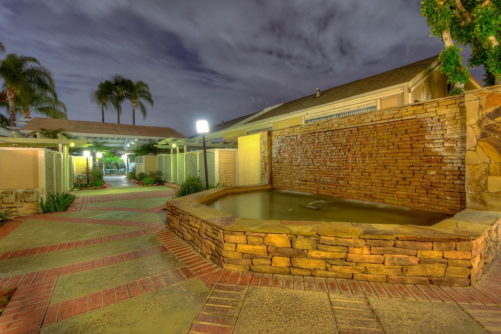 a hot tub sits in the middle of a building at night