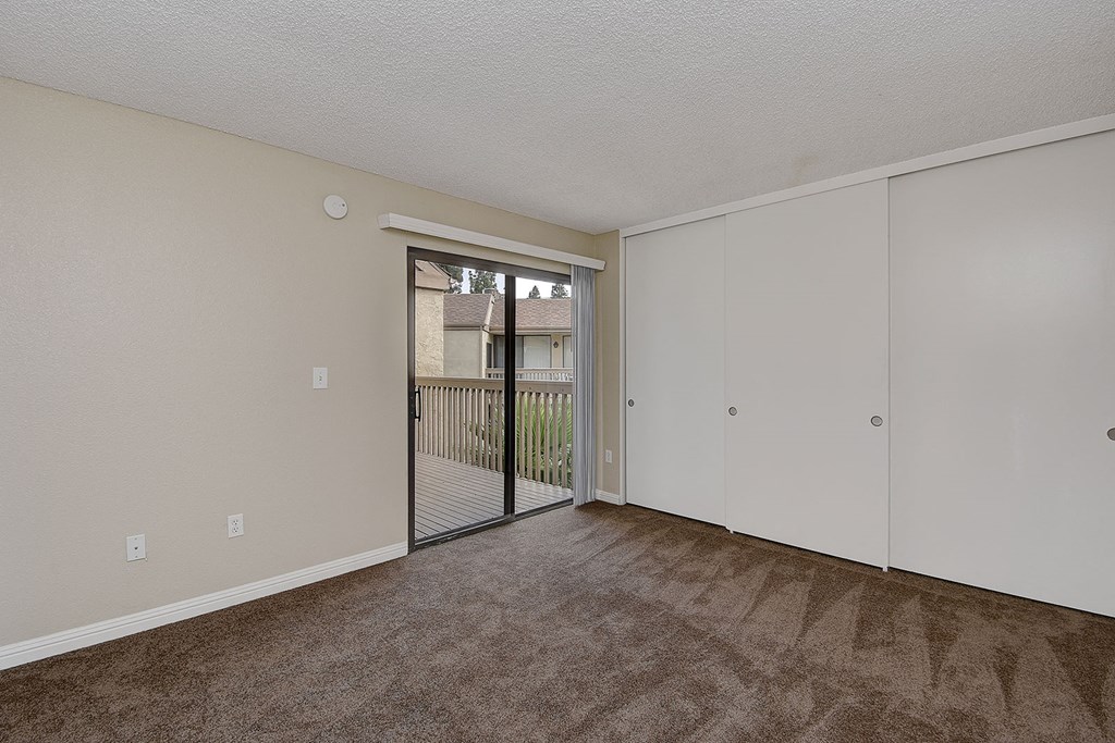 Bedroom with balcony at LAKE DIANNE, Santa Ana, CA, 92705