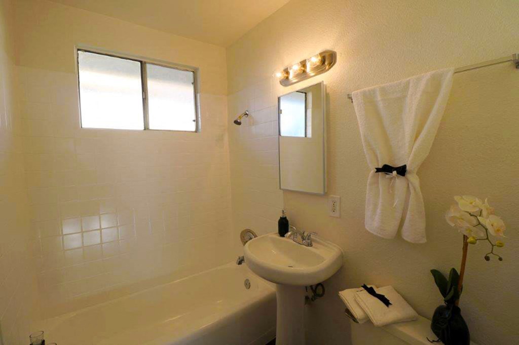 a bathroom with a sink and a bath tub