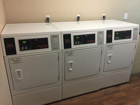 a group of white appliances sitting in a room