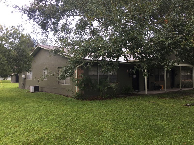 a house with a yard and a tree