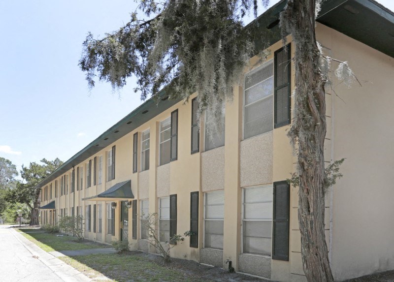 a large building with a tree in front of it