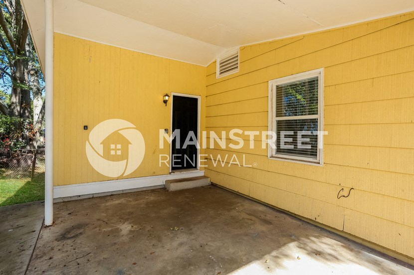 a garage with a door and a yellow wall