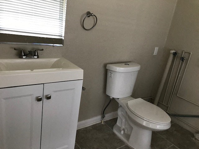 a bathroom with a toilet and a sink