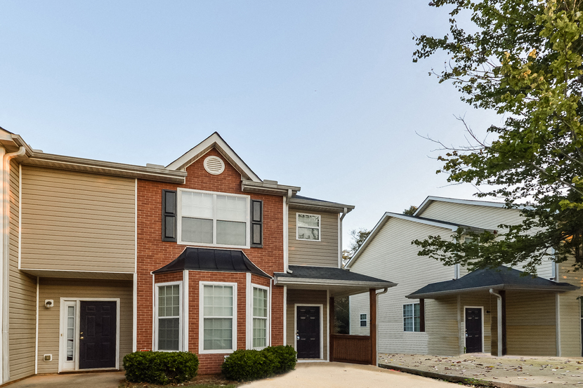 a house with a driveway in front of it