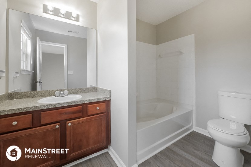 a bathroom with a sink toilet and a shower