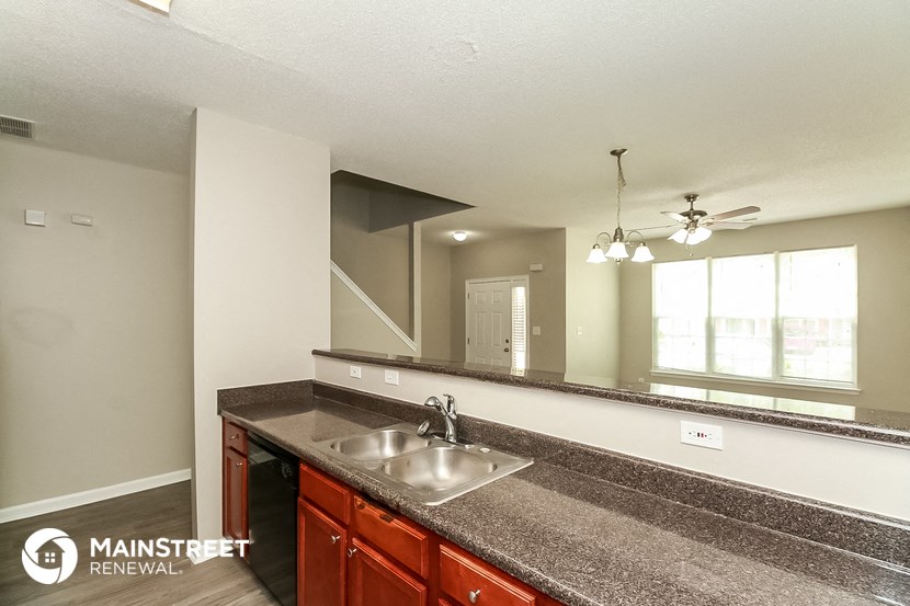 a kitchen with granite counter tops and a sink