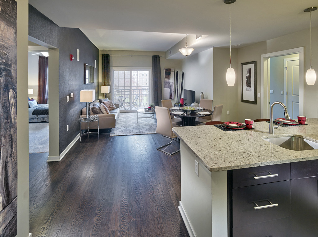 an open floor plan with a kitchen and living room