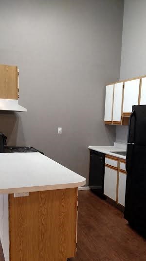 Image of kitchen with cabinets and appliances