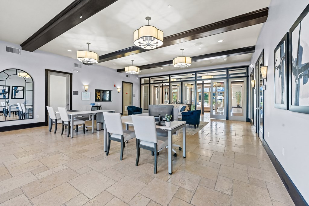 A spacious dining area with a table set for six.