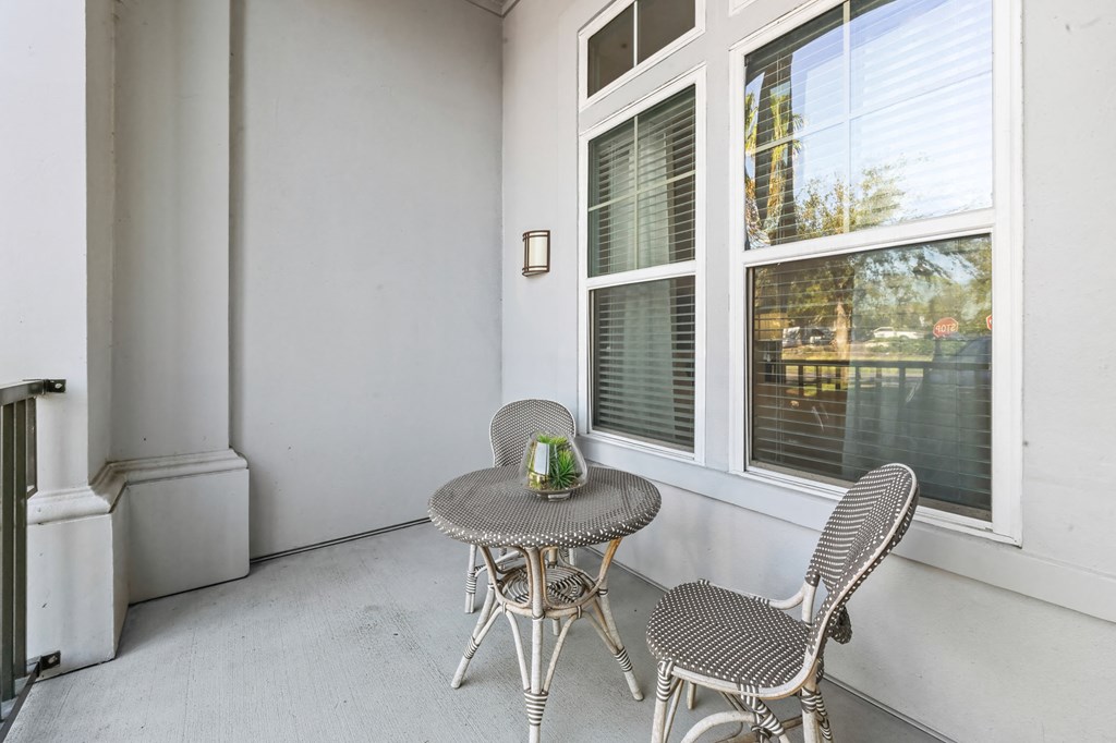 A patio with a table and chairs is shown.