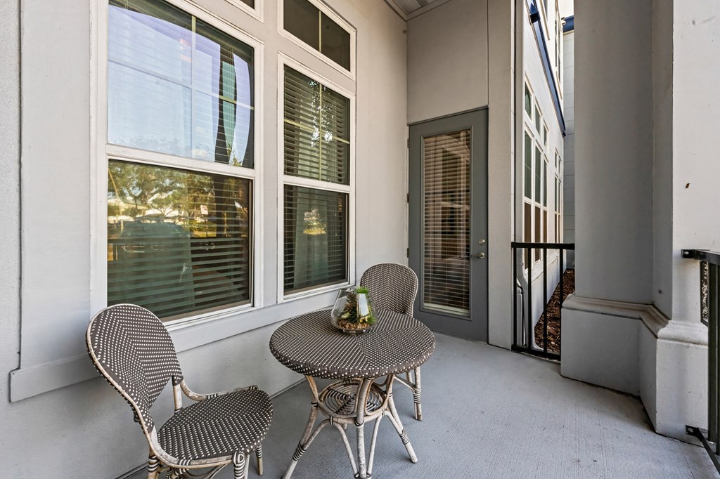 A patio with a table and chairs is shown.